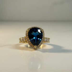 Bague ajustable dorée avec pierre ovale bleu saphir